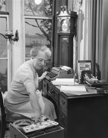 Helen Creighton working at her desk at Evergreen, 1958